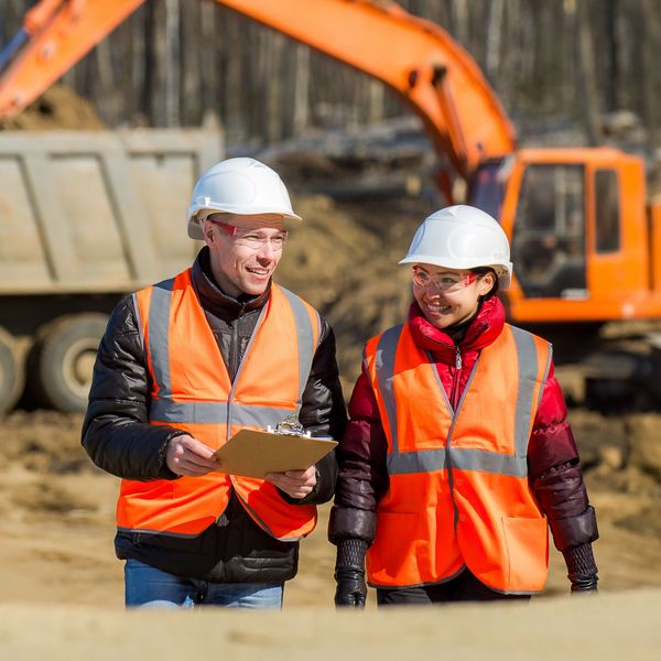 Road workers inspecting construction